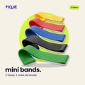 Cinco mini bands nas cores amarelo, vermelho, azul, preto e verde, foto real
